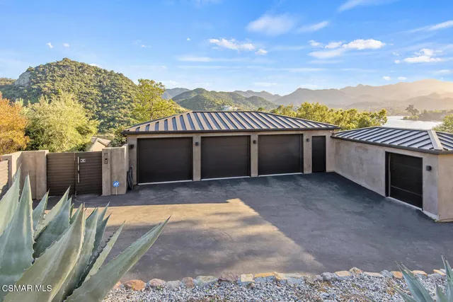 a kitchen with granite countertop cabinets stainless steel appliances and wooden floor