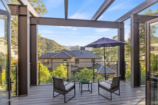 a bedroom with a bed and glass door