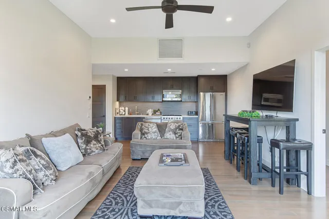 a view of a chairs and table in the balcony