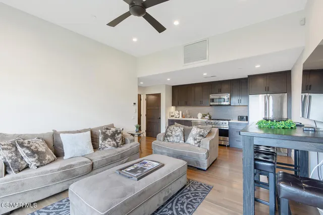 a large bed in a bedroom and a mirror