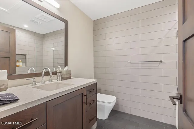 a kitchen with stainless steel appliances granite countertop a stove and a sink