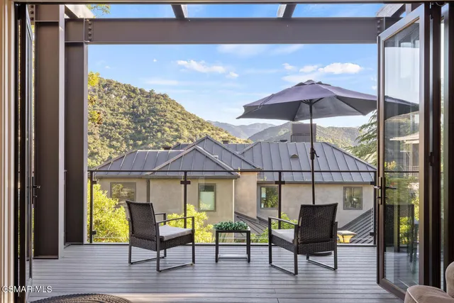 a kitchen with stainless steel appliances kitchen island granite countertop a sink a stove and a refrigerator