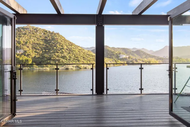 a bathroom with a bathtub sink vanity mirror and next to a window