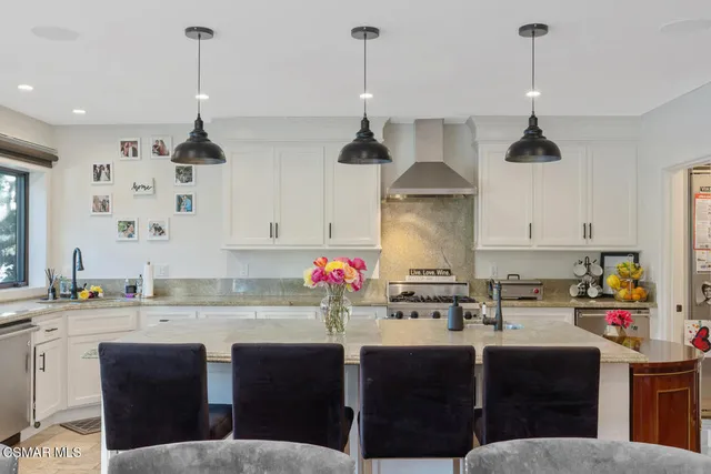 a bedroom with a large bed and a large window