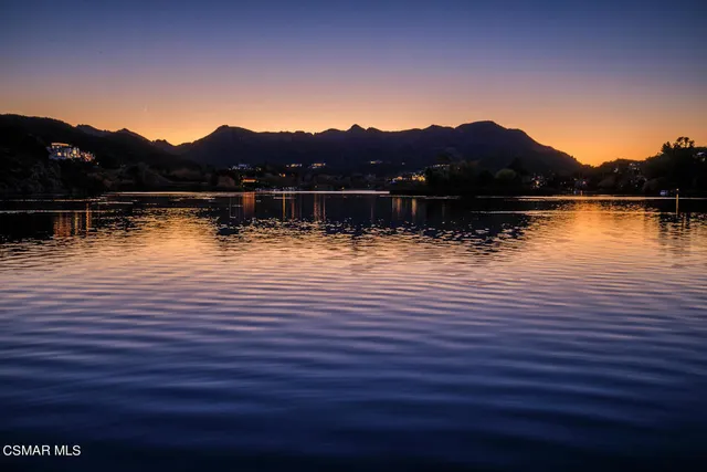 a view of a city with mountains in the background