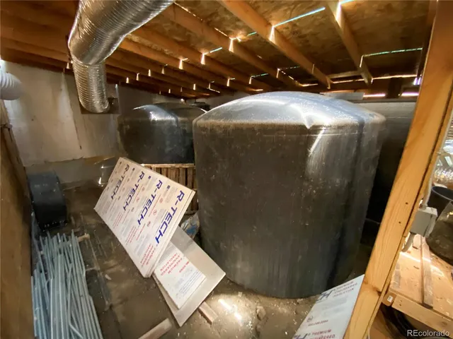 a view of a hallway with wooden floor and entryway