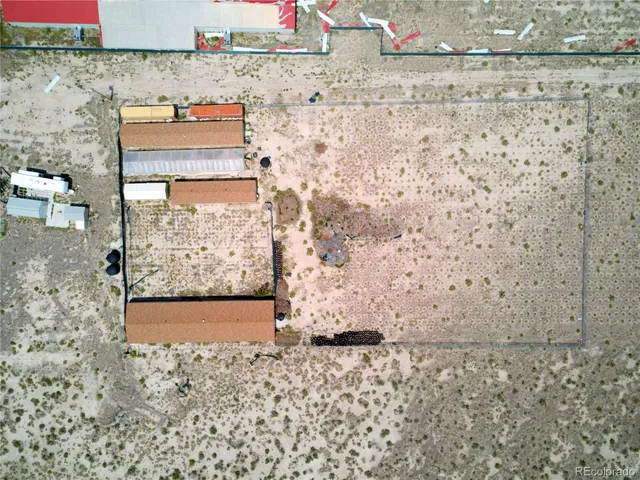 a view of a house with a sink and a yard