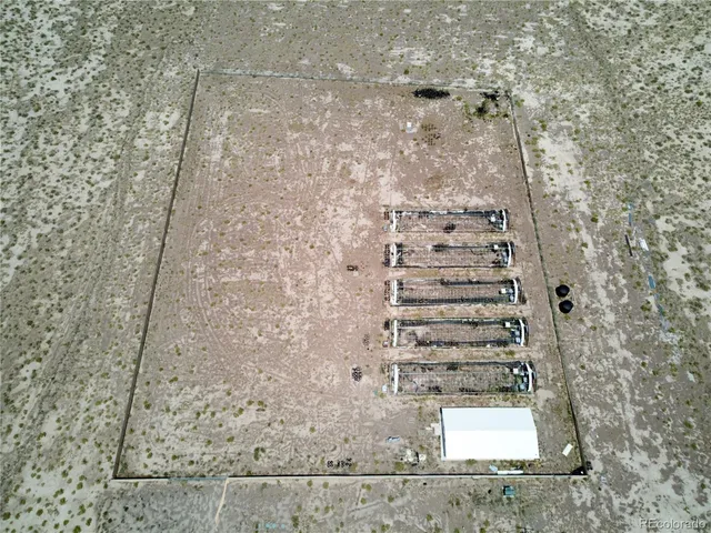 a bedroom with furniture and a large window