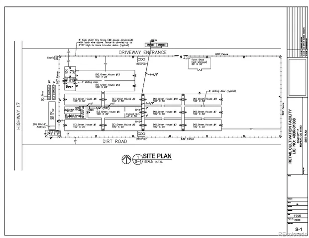 a living room with patio furniture and a kitchen