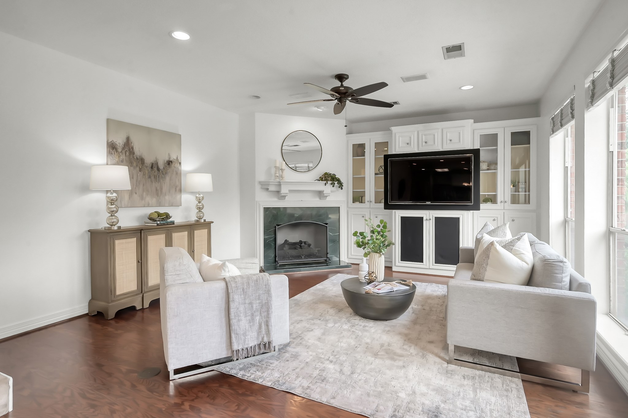 16403 Agusta Court Spring, TX 77379 - Photo 11 of 36 a living room with furniture a fireplace and a flat screen tv