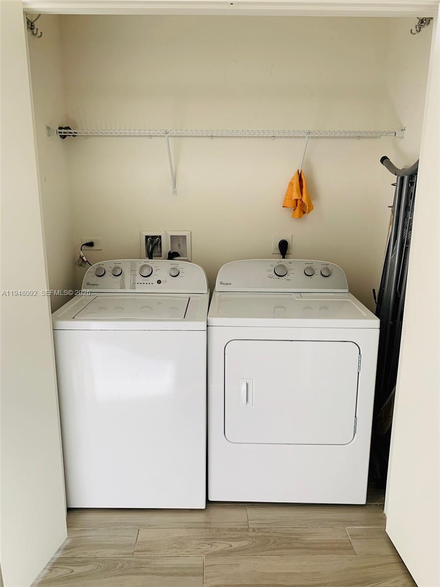 999 Southwest 1st Avenue, Unit 2310 Miami, FL 33130 - Photo 13 of 17 a utility room with dryer and washer