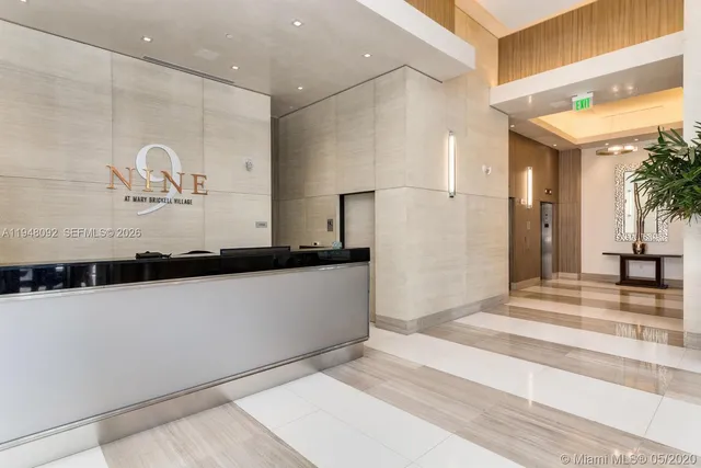 a view of a bathroom with sink mirror and shower