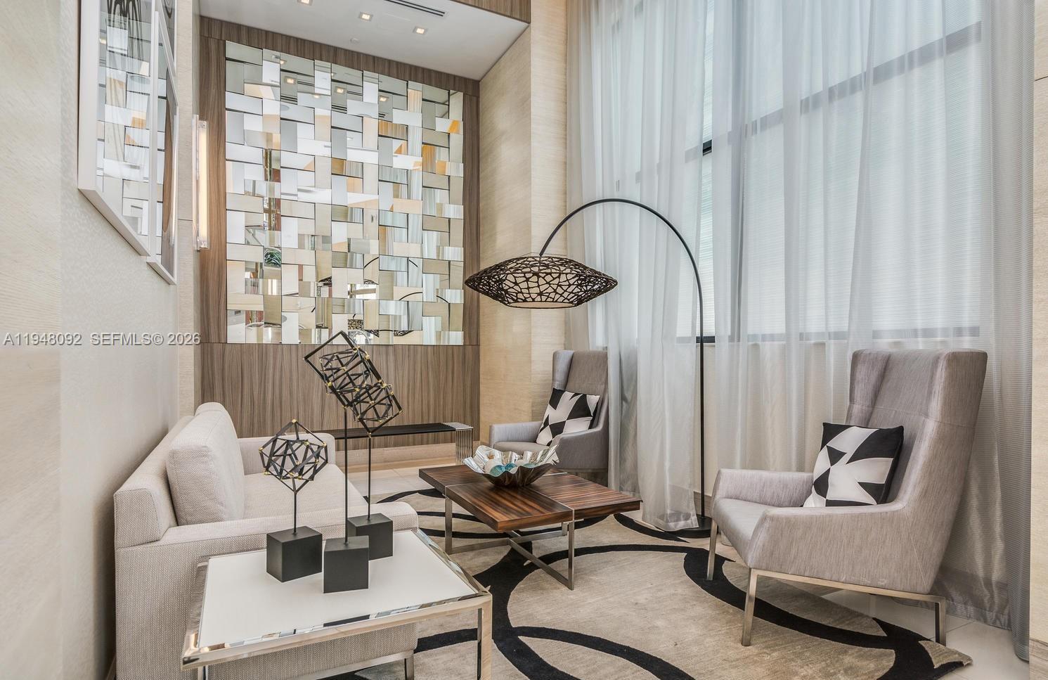 999 Southwest 1st Avenue, Unit 2310 Miami, FL 33130 - Photo 6 of 17 a living room with furniture and a window