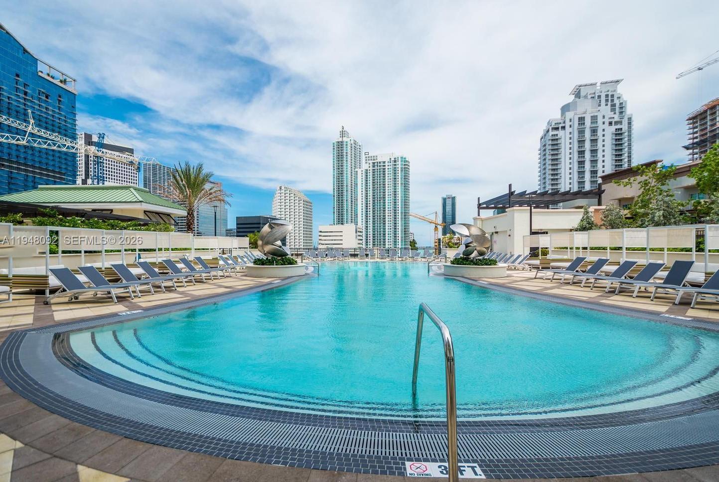 999 Southwest 1st Avenue, Unit 2310 Miami, FL 33130 - Photo 7 of 17 a view of a swimming pool and outdoor space