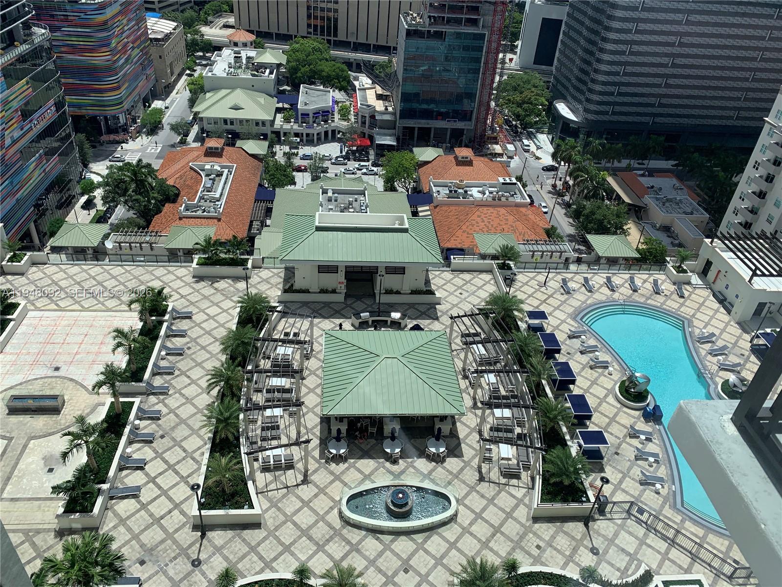 999 Southwest 1st Avenue, Unit 2310 Miami, FL 33130 - Photo 8 of 17 an aerial view of multiple houses with yard