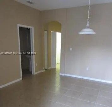 wooden floor in an empty room and a window