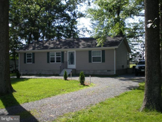 4744 Poplar Neck Road Preston, MD 21655 - Photo 1 of 11 a backyard of a house with yard and tree