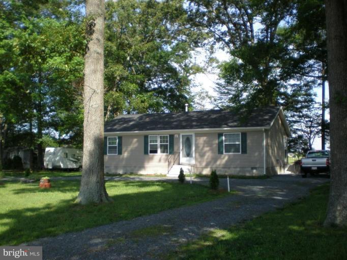 4744 Poplar Neck Road Preston, MD 21655 - Photo 2 of 11 a front view of house with yard and green space