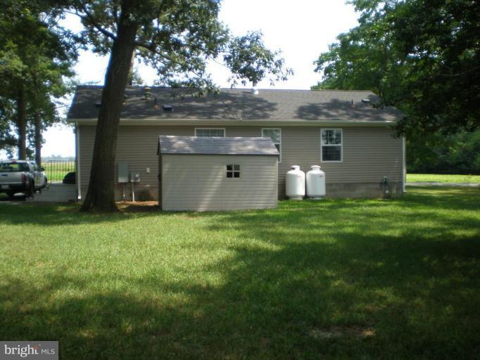 4744 Poplar Neck Road Preston, MD 21655 - Photo 3 of 11 a view of a backyard with large trees