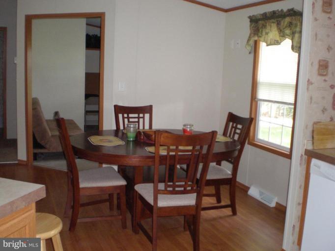 4744 Poplar Neck Road Preston, MD 21655 - Photo 5 of 11 a view of a dining room with furniture and window