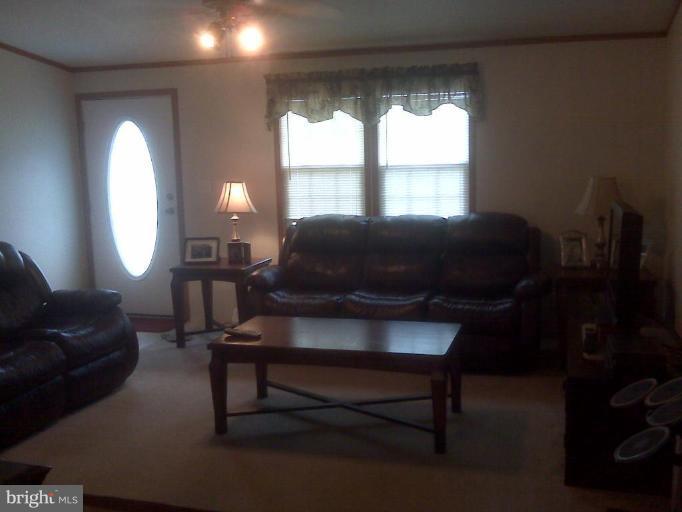 4744 Poplar Neck Road Preston, MD 21655 - Photo 9 of 11 a living room with furniture and a large window