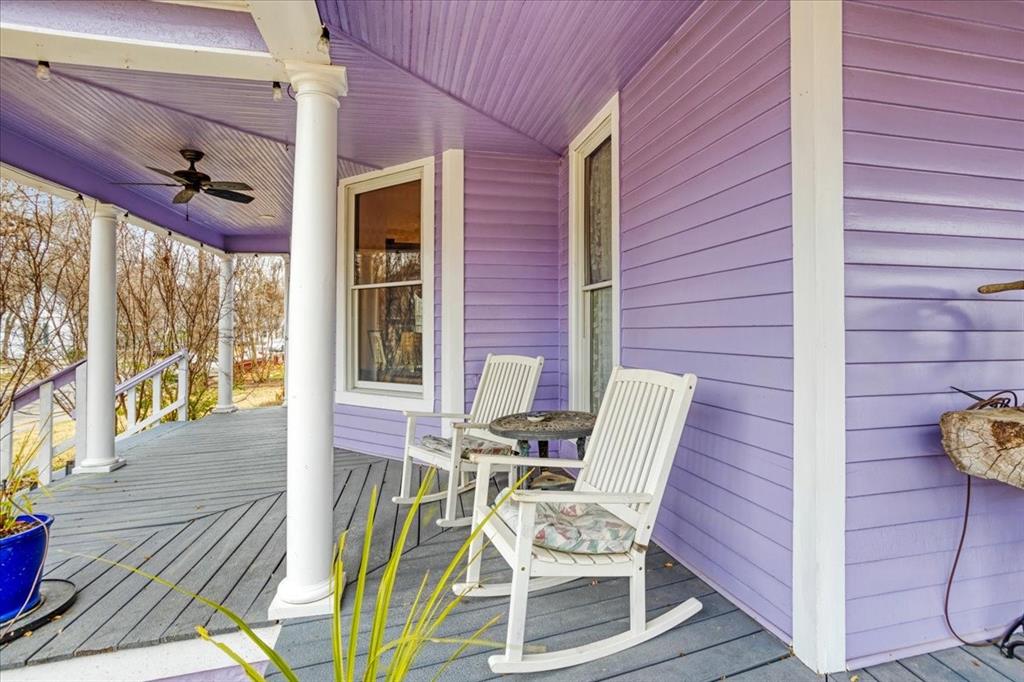 300 West 6th Street Bonham, TX 75418 - Photo 27 of 37 a view of a patio with table and chairs and wooden floor