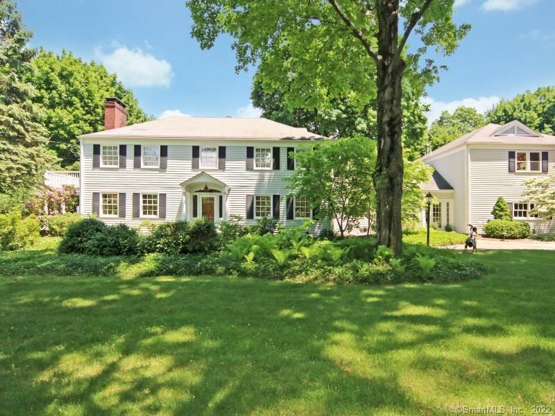 14 Currituck Road Newtown, CT 06470 - Photo 1 of 1 a front view of a house with a garden