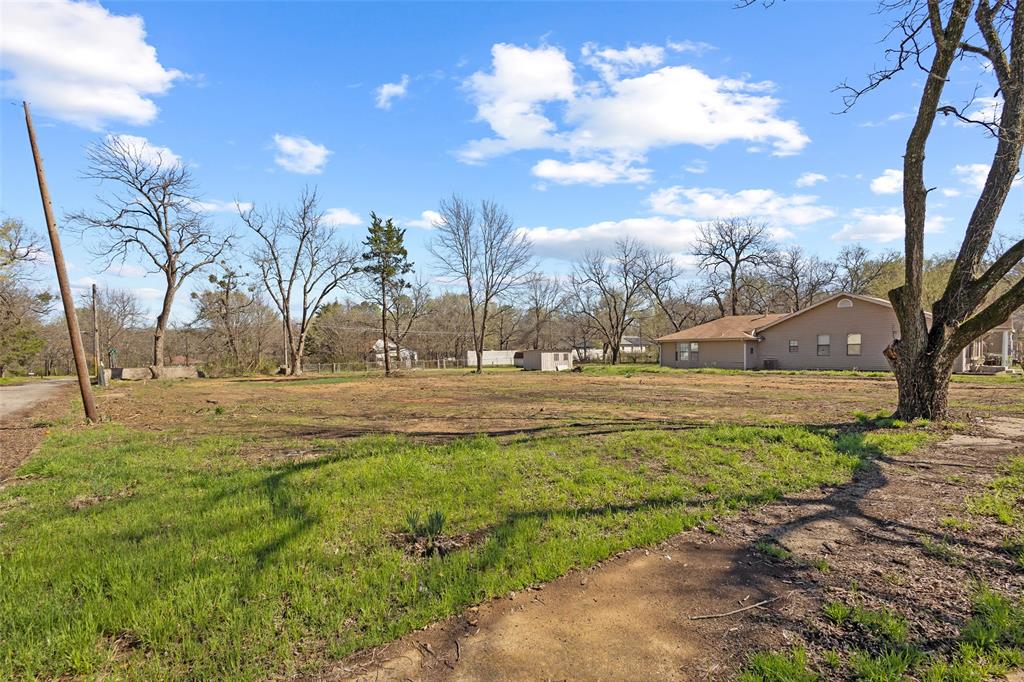 705 East Cherry Street Paris, TX 75460 - Photo 2 of 7 a view of yard with large trees