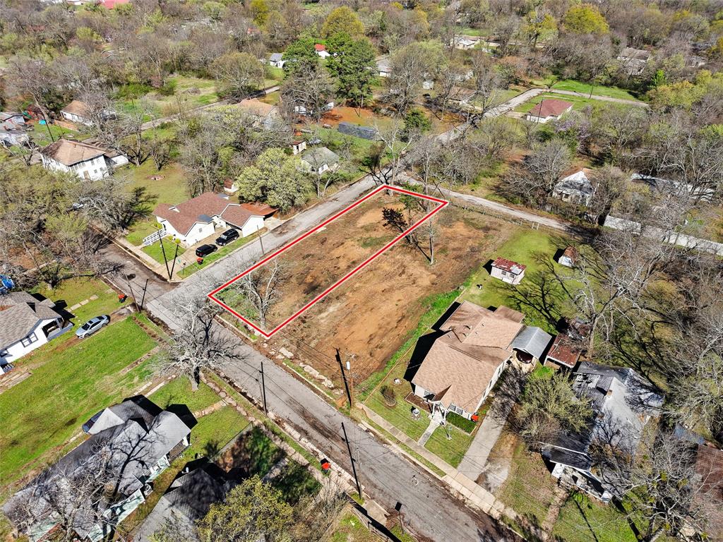 705 East Cherry Street Paris, TX 75460 - Photo 7 of 7 an aerial view of a house with a yard