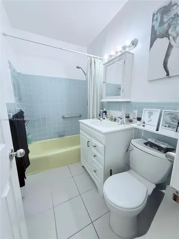 a bathroom with a sink toilet and bathtub