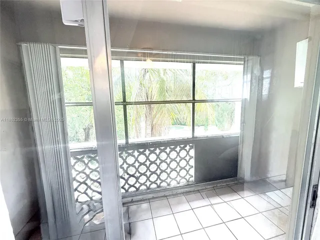 a view of empty room with windows