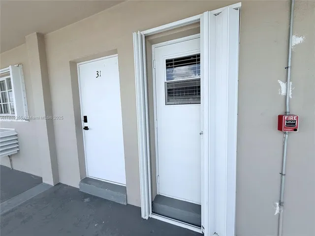 a view of a hallway with elevator