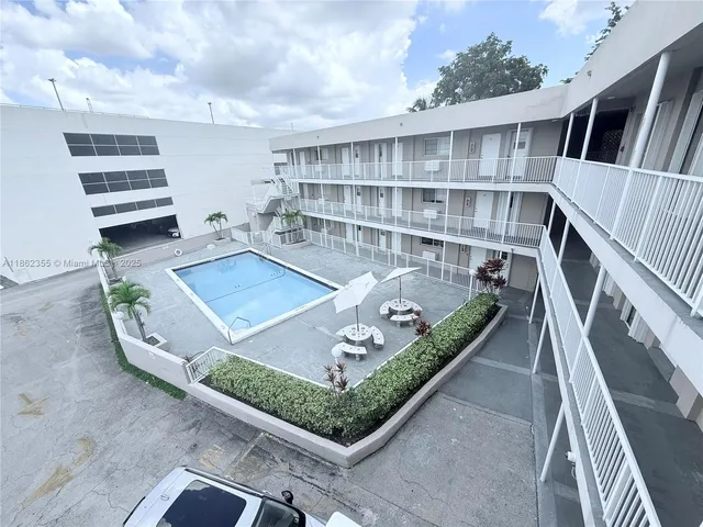 a view of balcony with a dining table