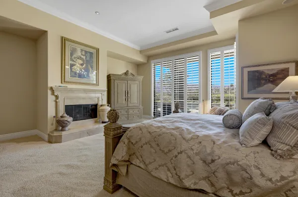 a living room with furniture and a walk in closet