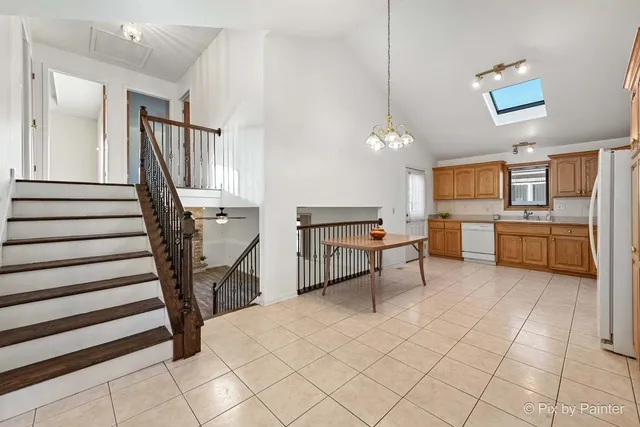 a view of a kitchen with furniture and staircase
