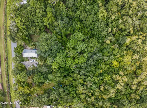 a view of a house with a tree