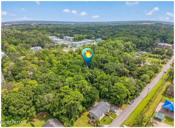 a aerial view of a house with a garden and space