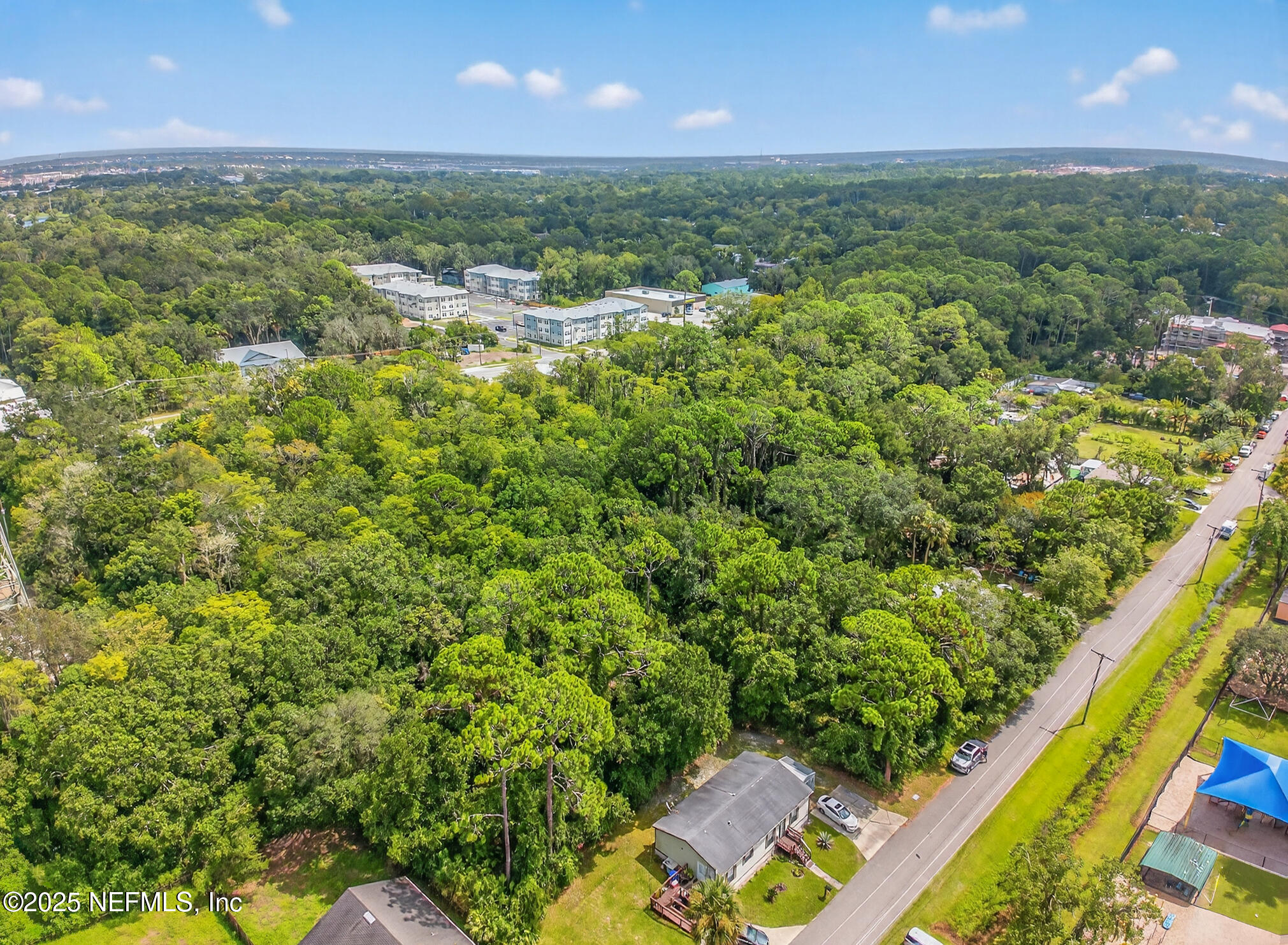 933 John Street St. Augustine, FL 32084 - Photo 7 of 19 a view of a yard & street from a building