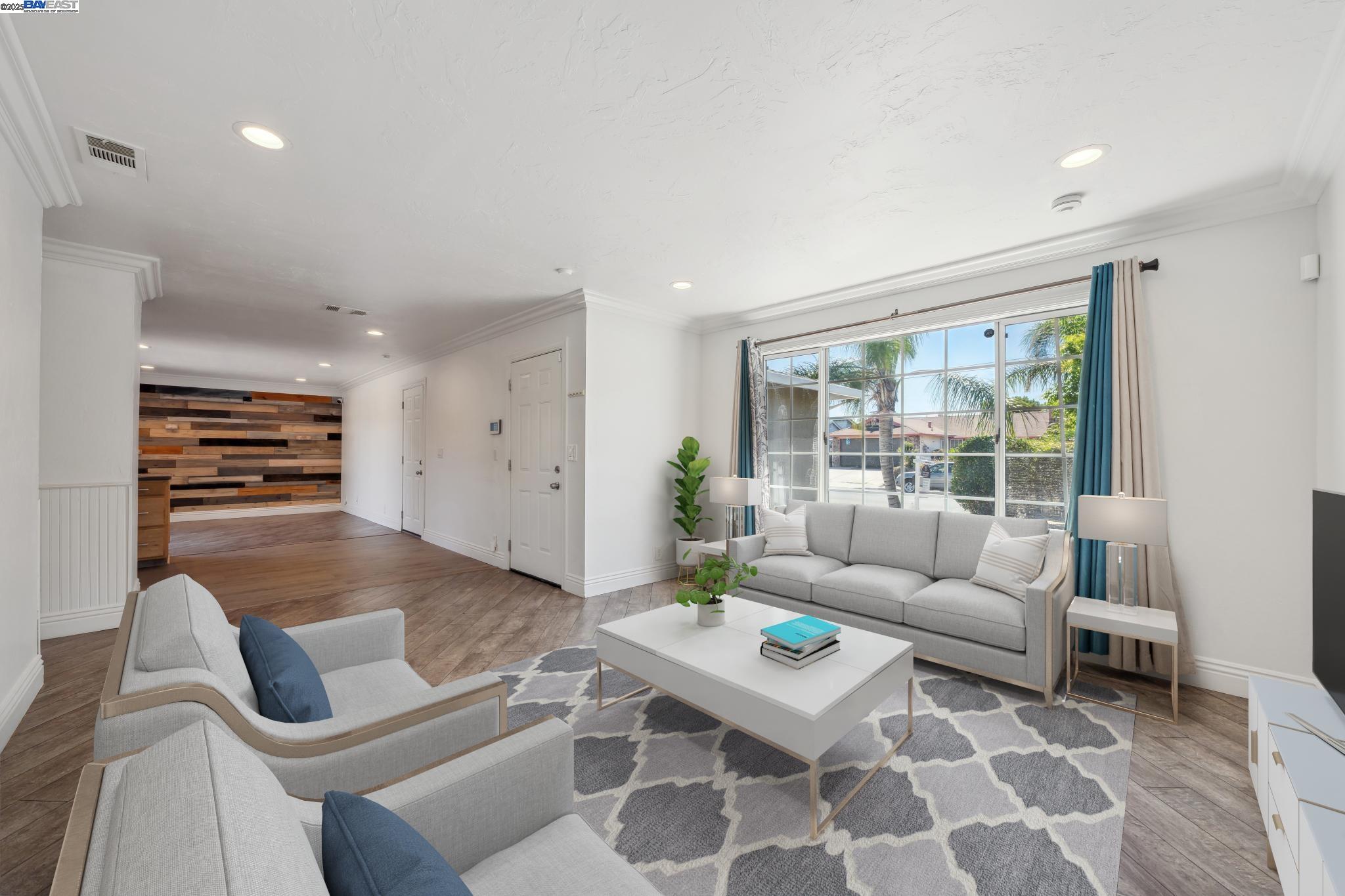 148 Spinnaker Pittsburg, CA 94565 - Photo 3 of 24 a living room with furniture and a large window