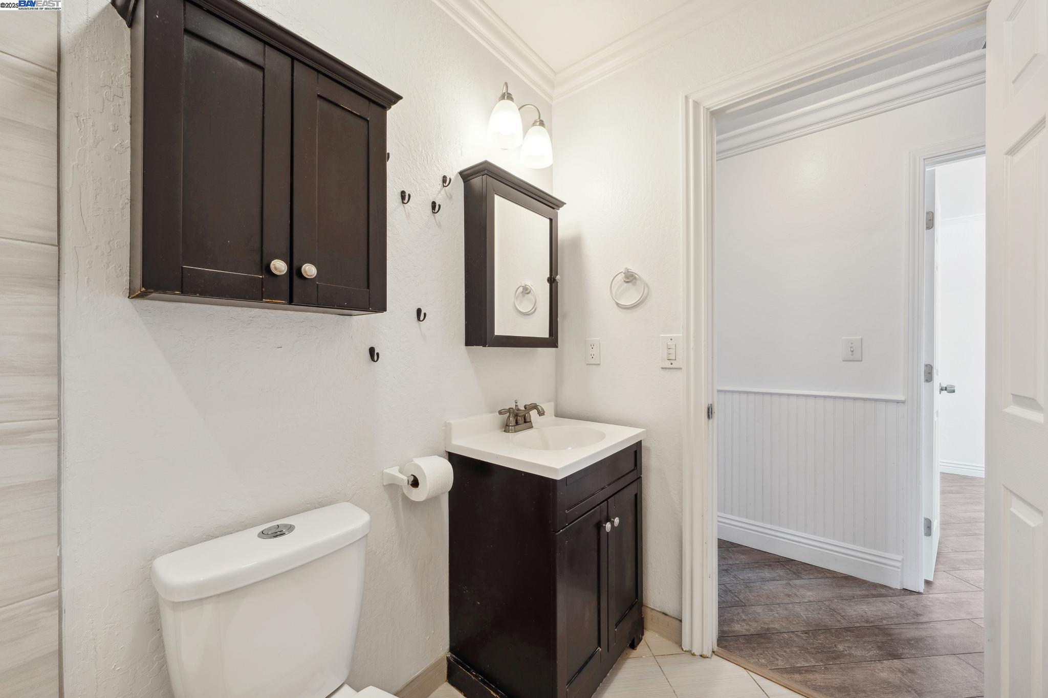 148 Spinnaker Pittsburg, CA 94565 - Photo 10 of 24 a bathroom with a sink a toilet and mirror