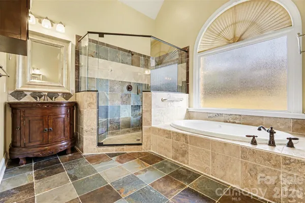 a view of a yard with plants and trees