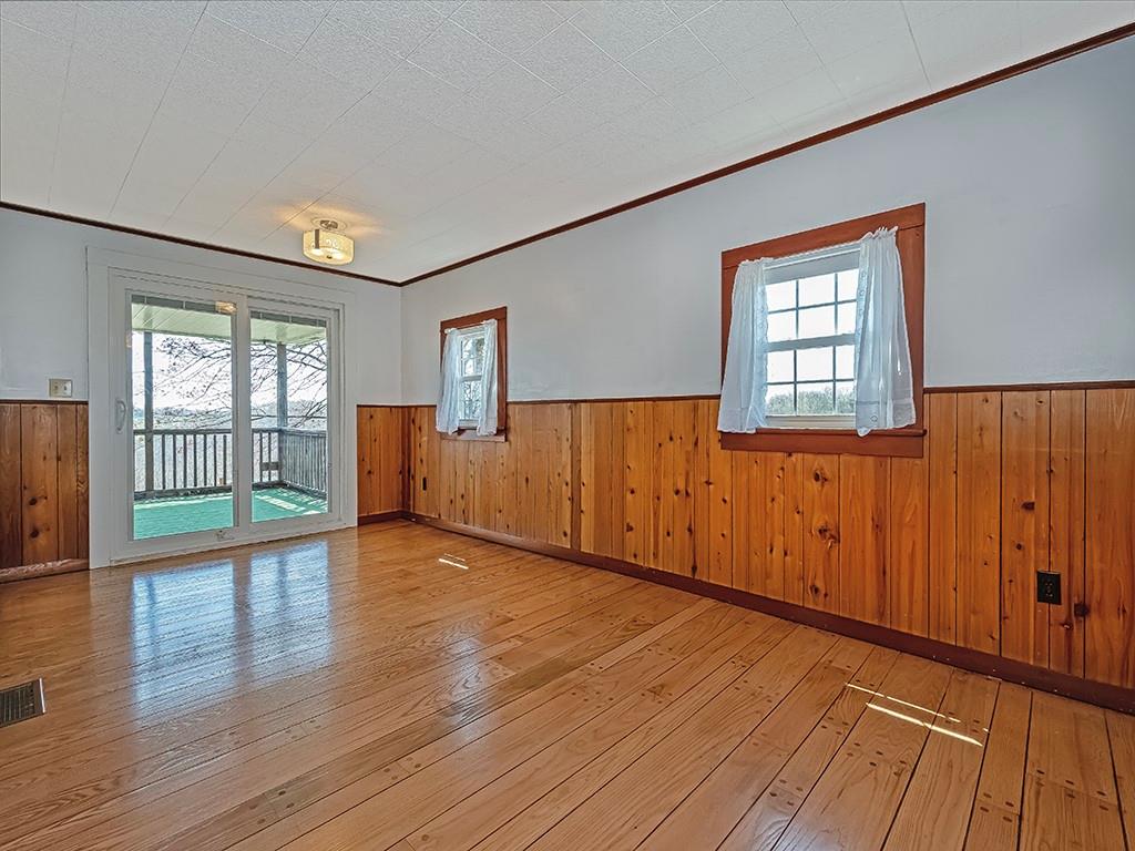 188 Thorn Run Road Butler, PA 16001 - Photo 13 of 25 wooden floor in an empty room with a window