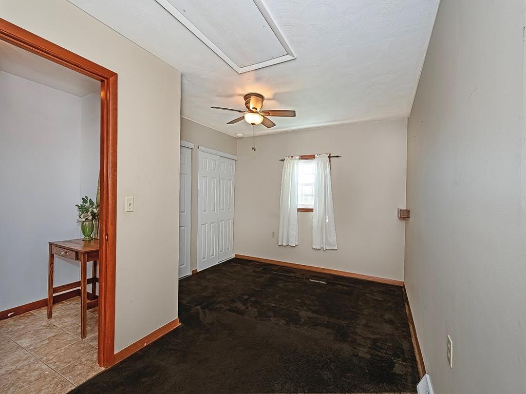 188 Thorn Run Road Butler, PA 16001 - Photo 18 of 25 an empty room with closet and a chandelier fan