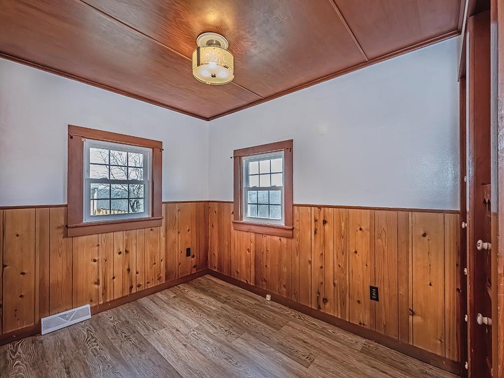 188 Thorn Run Road Butler, PA 16001 - Photo 20 of 25 an empty room with wooden floor and windows
