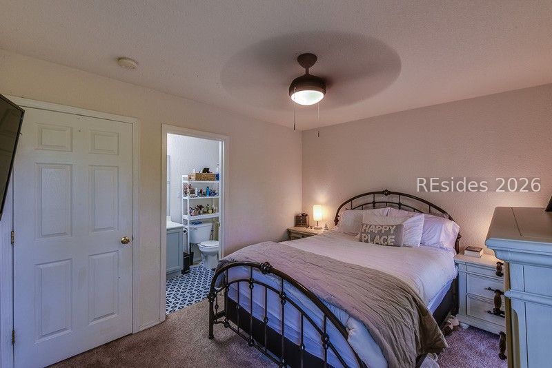 406 Park Side Way Bluffton, SC 29909 - Photo 20 of 39 Neutral carpet and ceiling fan