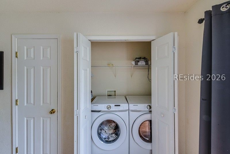 406 Park Side Way Bluffton, SC 29909 - Photo 27 of 39 Interior washer and dryer with shelving