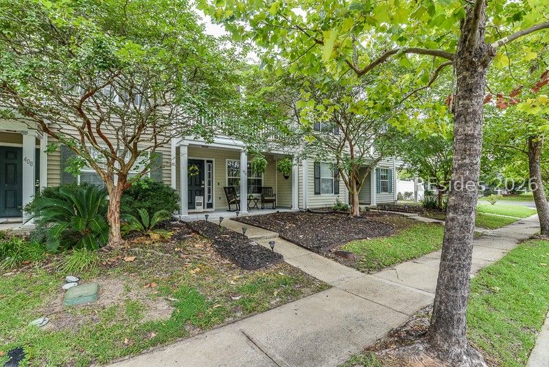 406 Park Side Way Bluffton, SC 29909 - Photo 3 of 39 Tree-lined walkway and covered porch