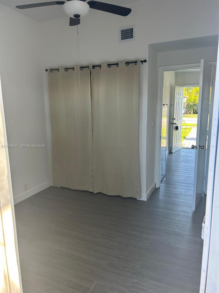 10296 Southwest 175th Street, Unit 10296 Miami, FL 33157 - Photo 2 of 9 a view of a room with wooden floor
