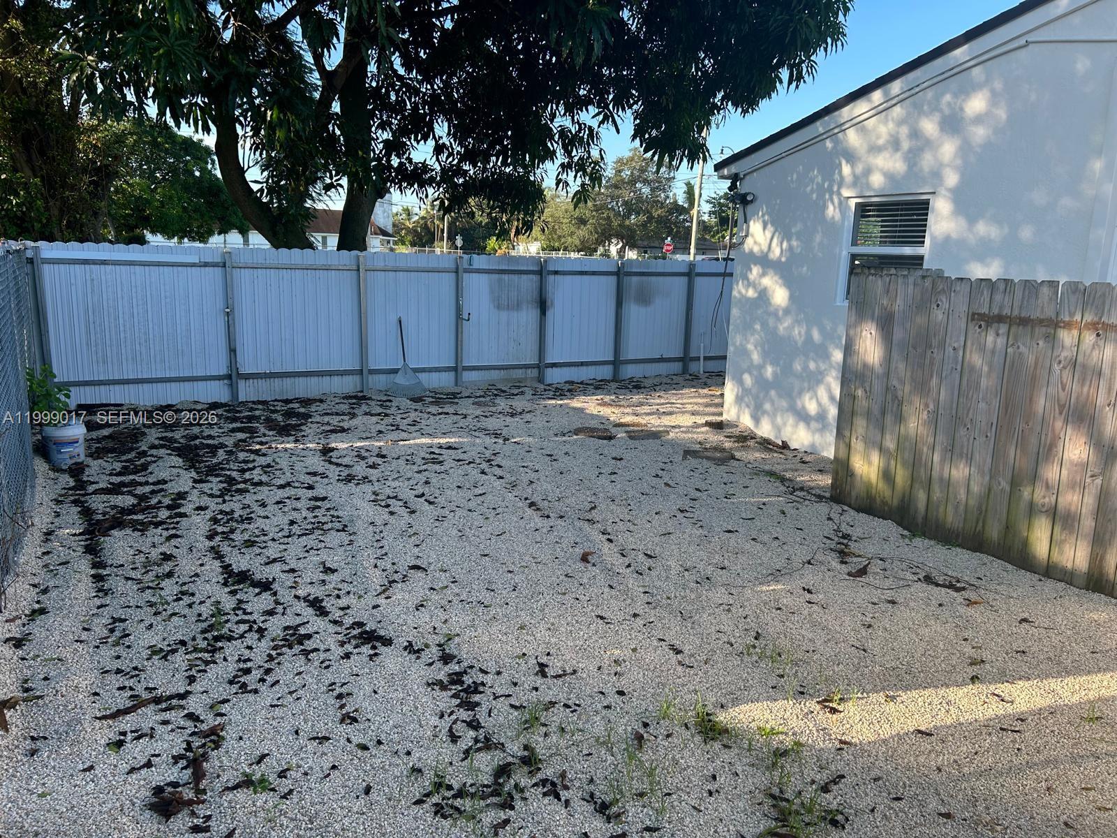 10296 Southwest 175th Street, Unit 10296 Miami, FL 33157 - Photo 4 of 9 a backyard of a house