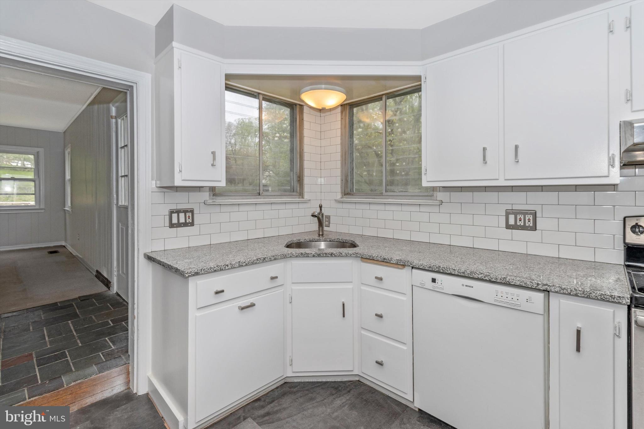 414 Devon State Road Devon, PA 19333 - Photo 12 of 31 a kitchen with white cabinets and sink